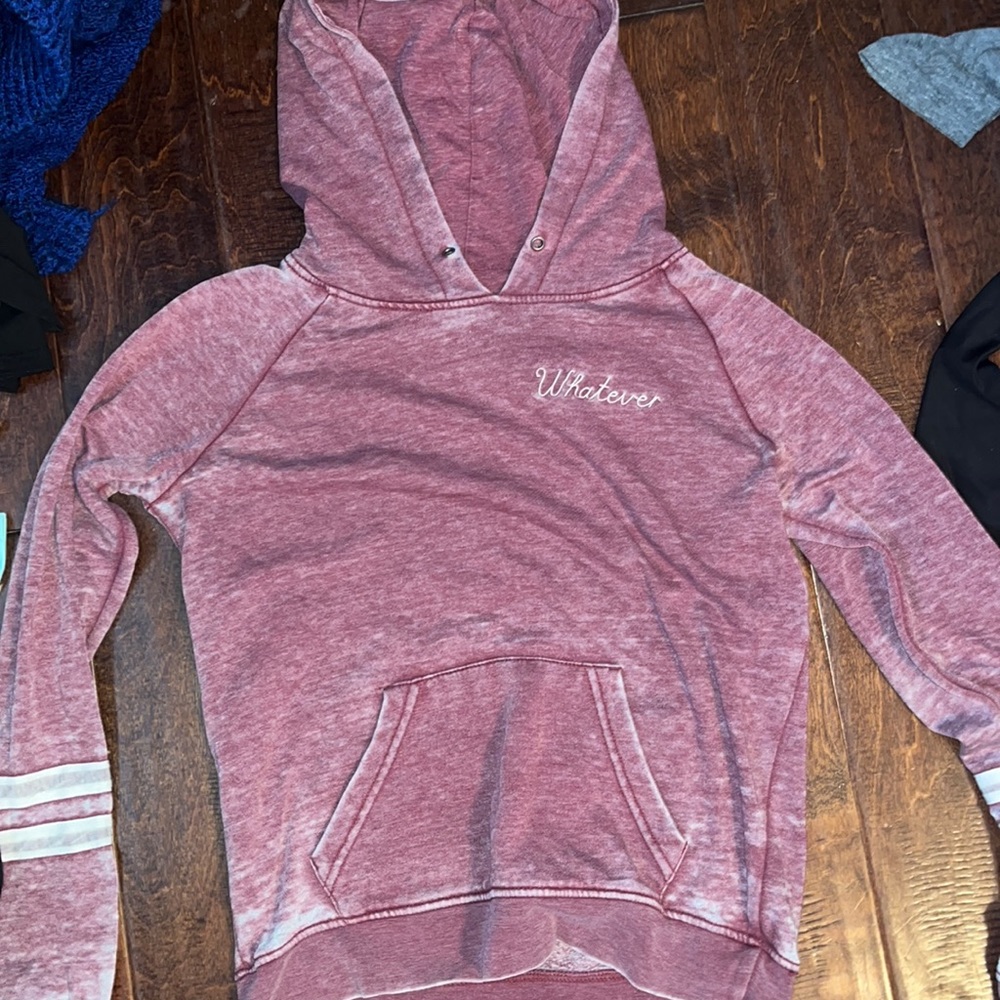 Pink hoodie with the word whatever on the front